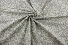 Load image into Gallery viewer,  The Robert Allen© Indiki Blooms in Greystone fabric is perfect for multipurpose use, featuring a unique floral print that blends the grey and natural colorways.  Made from highly durable cotton, this fabric offers up to 100,000 double rubs.  It can be used for several different statement projects including window accents (drapery, curtains and swags), toss pillows, headboards, bed skirts, duvet covers, upholstery, and more.
