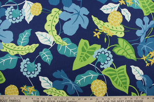 Robert Allen© Sunscape in Caribe is a multipurpose fabric printed with a vibrant floral vine pattern, featuring green, yellow, caribe, white, sky blue, and turquoise on a navy blue background. The fabric is durable with 50,000 double rubs and is resistant to soil and stains. It can be used for several different statement projects including window accents (drapery, curtains and swags), toss pillows, headboards, bed skirts, duvet covers and upholstery. 