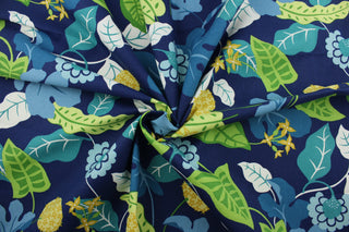 Robert Allen© Sunscape in Caribe is a multipurpose fabric printed with a vibrant floral vine pattern, featuring green, yellow, caribe, white, sky blue, and turquoise on a navy blue background. The fabric is durable with 50,000 double rubs and is resistant to soil and stains. It can be used for several different statement projects including window accents (drapery, curtains and swags), toss pillows, headboards, bed skirts, duvet covers and upholstery. 