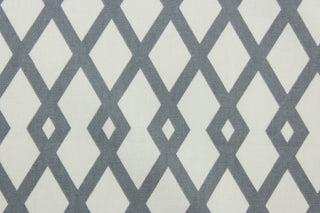 Discover the ultimate multi-purpose fabric with Robert Allen© Graphic Fret in Greystone.  Featuring a distinct geometric print in subtle grey and off-white, this durable fabric is rated for 40,000 double rubs and is soil and stain repellant.  Add modern style to any interior with this luxurious fabric. It can be used for several different statement projects including window accents (drapery, curtains and swags), toss pillows, headboards, bedding, upholstery, and more.