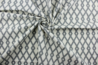 Discover the ultimate multi-purpose fabric with Robert Allen© Graphic Fret in Greystone.  Featuring a distinct geometric print in subtle grey and off-white, this durable fabric is rated for 40,000 double rubs and is soil and stain repellant.  Add modern style to any interior with this luxurious fabric. It can be used for several different statement projects including window accents (drapery, curtains and swags), toss pillows, headboards, bedding, upholstery, and more.