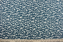 Load image into Gallery viewer, Duralee&#39;s Anka in Peacock fabric is a stylish, multi-purpose fabric featuring a stunning peacock blue and off-white pattern.  With soil and stain repellent properties, this fabric is perfect for your home décor needs.  It can be used for several different statement projects including window accents (drapery, curtains and swags), toss pillows, headboards, bed skirts, duvet covers, upholstery, and more.
