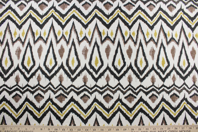 Suburban Fabrics© Clyde in Black/Gold is a multipurpose low pile printed chenille featuring an ethnic geometric design in black, brown, and gold against a pearl background.  Its soil and stain repellant with 50,000 double rubs makes it perfect for active households.  It is great for upholstery projects including sofas, chairs, dining chairs, pillows, handbags and craft projects. 