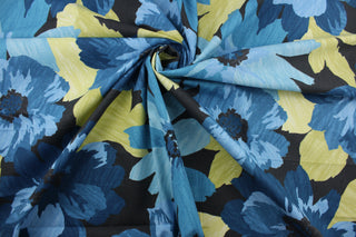 Robert Allen© Kobila in Deep Pool, is a multi-purpose fabric featuring a large floral print in shades of blue, yellow green and black.  This fabric is incredibly tough, boasting a 100,000 double rub rating, and is soil and stain repellent to help keep it looking as good as new.  It can be used for several different statement projects including window accents (drapery, curtains and swags), toss pillows, headboards, bed skirts, duvet covers, upholstery, and more.