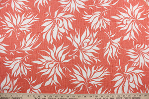 The Duralee© Bella in Coral is a versatile fabric that will give an elegant touch to any room.  The fabric features white leaves against a coral background, and it is made of high-performance fibers that make it highly durable: it has up to 50,000 double rubs and is soil and stain repellant.  It can be used for several different statement projects including window accents (drapery, curtains and swags), toss pillows, headboards, bed skirts, duvet covers, upholstery, and more.