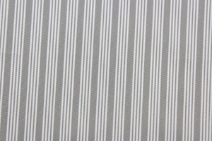 Robert Allen© Dateline is a versatile fabric with a horizontally vertically striped pattern.  Combining sterling gray with a crisp white hue, this luxurious fabric is perfect for modern décor.  It can be used for several different statement projects including window accents (drapery, curtains and swags), toss pillows, headboards, bed skirts, duvet covers, upholstery, and more.