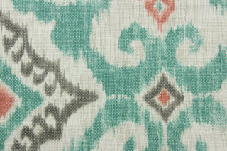The Covington© Kanta in Surf features a striking combination of geometric and ikat prints in shades of coral, gray, turquoise, and cream.  With an impressive 30,000 double rubs durability, it's both stylish and functional for any space. The multi use fabric is perfect for window treatments, decorative pillows, custom cushions, bedding, light duty upholstery applications and almost any craft project.  