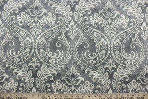  The Covington© Toulouse in Slate is a versatile and durable fabric, boasting a large-scale floral damask design in slate and cream.  With an impressive 50,000 double rub count, this fabric is perfect for any multi-use project.  The fabric is perfect for window accents (draperies, valances, curtains and swags) cornice boards, accent pillows, bedding, headboards, cushions, ottomans, slipcovers and upholstery.  