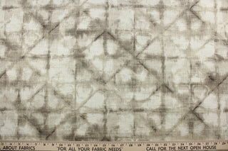 This fabric is a blend of cotton and linen with brown hues featuring a shibori style print.  It can be used for several different statement projects including window accents (drapery, curtains and swags), decorative pillows, hand bags, bed skirts, duvet covers, upholstery and craft projects.  It has a soft workable feel yet is stable and has a durability rating of 20,000 double rubs.