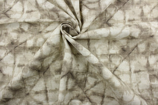 This fabric is a blend of cotton and linen with brown hues featuring a shibori style print.  It can be used for several different statement projects including window accents (drapery, curtains and swags), decorative pillows, hand bags, bed skirts, duvet covers, upholstery and craft projects.  It has a soft workable feel yet is stable and has a durability rating of 20,000 double rubs.
