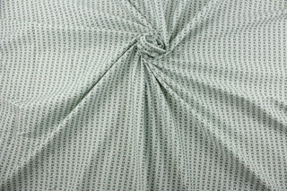 Experience the versatility of Covington© Fairmont in Mist. This multipurpose fabric boasts a beautiful foulard print in shades of gray, white, and powder blue.  With a durability of 50,000 double rubs, it's perfect for any project you have in mind.  The fabric is perfect for window accents (draperies, valances, curtains and swags) cornice boards, accent pillows, bedding, headboards, cushions, ottomans, slipcovers and upholstery.  