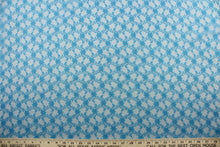 Load image into Gallery viewer, Our Woven Lace in Sapphire Blue is expertly crafted with a dainty floral design.  Add an elegant touch to any project with this high-quality lace.  Made with precision and attention to detail, our lace adds a sophisticated touch to your creations.  Uses include apparel, costumes, and home décor.
