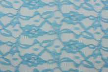 Load image into Gallery viewer,  Our Woven Lace in Royal Blue is expertly crafted with a delicate floral design.  Add an elegant touch to any project with this high-quality lace.  Made with precision and attention to detail, our lace adds a sophisticated touch to your creations.  Uses include apparel, costumes, and home décor.
