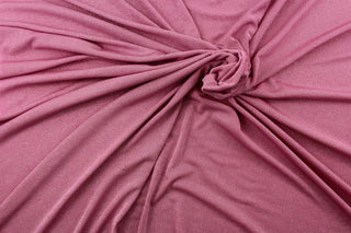 Glittered in Light Pink boasts a beautiful pink hue adorned with silver glittering sparkles to add a touch of glam.  Enjoy ultimate comfort and flexibility with its 8 way stretch material.  Perfect for adding sparkle to special occasion apparel, dancewear, costumes, overlays, table tops, and decorations. 