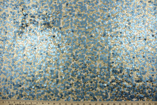 This Sequined Net in Blue/Gold is perfect for adding a touch of glamour to any project.  The carefully crafted sequins in blue and gold shimmer on the cream colored tulle base, creating a beautiful and unique look.  Perfect for adding sparkle to special occasion apparel, dancewear, costumes, overlays, table tops, and decorations. 