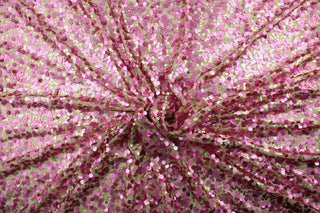This Sequined Net in Pink/Gold is perfect for adding a touch of glamour to any project.  The carefully crafted sequins in pink and gold shimmer on the cream colored tulle base, creating a beautiful and unique look.  Perfect for adding sparkle to special occasion apparel, dancewear, costumes, overlays, table tops, and decorations. 
