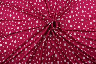 Add some sparkle to your projects with Glitter Dots in Pink.  Featuring a pink background and white polka dots, this fabric also has a touch of pink glitter for extra shine.  Made with 8 way stretch, it is perfect for any project that requires both durability and style.  Perfect for special occasion apparel, dancewear, costumes, overlays, table tops, and decorations. 