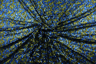 This Sequined Swirls design features a unique blend of blue and green sequins on a black base cloth.  The intricate swirl pattern adds a touch of elegance to any design.  Made from a high-quality 4 way stretch polyester and lycra© base, this fabric provides flexibility and durability.  Perfect for adding sparkle to special occasion apparel, dancewear, costumes, overlays, table tops, and decorations. 