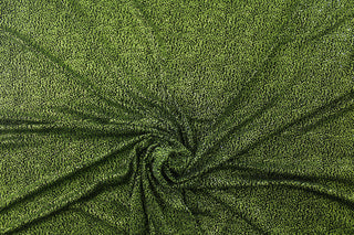 Experience a touch of glamour and elegance with our Glitz in Green.  Shimmer and shine in the green glitter detailing, complemented by a sleek and classic black base.  Enjoy ultimate comfort and flexibility with its 8 way stretch material.  Perfect for adding sparkle to special occasion apparel, dancewear, costumes, overlays, table tops, and decorations. 