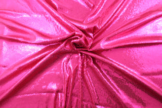 Achieve the perfect combination of comfort and style with our Sequined Shimmer in Hot Pink.  Made from a high-quality 8 way stretch polyester and lycra© base, this fabric provides flexibility and durability.  Perfect for adding sparkle to special occasion apparel, dancewear, costumes, overlays, table tops, and decorations. 