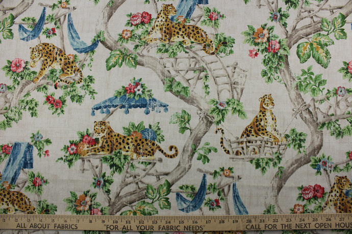 Featuring a stunning scenic jungle chinoiserie print with cheetahs, floral branches, and a variety of colors including blue, green, golden brown, black, and pink, all set against a distressed light tan background.  The versatile fabric is perfect for window accents (draperies, valances, curtains and swags) cornice boards, accent pillows, bedding, headboards, cushions, ottomans, slipcovers and upholstery. <span data-mce-fragment=