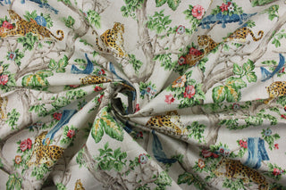 Featuring a stunning scenic jungle chinoiserie print with cheetahs, floral branches, and a variety of colors including blue, green, golden brown, black, and pink, all set against a distressed light tan background.&nbsp; The versatile fabric is perfect for window accents (draperies, valances, curtains and swags) cornice boards, accent pillows, bedding, headboards, cushions, ottomans, slipcovers and upholstery. <span data-mce-fragment="1">&nbsp;</span>