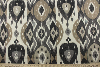 Expertly crafted with an ethnic ikat print, P Kaufmann© Buketan in Granite is a multipurpose cotton duck fabric that adds a touch of elegance to any project. The striking combination of black, brown, and ivory against a granite background is sure to make a statement. The versatile fabric is perfect for window accents (draperies, valances, curtains and swags) cornice boards, accent pillows, bedding, headboards, cushions, ottomans, slipcovers and upholstery. <span data-mce-fragment="1">&nbsp;</span>