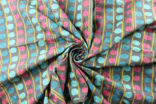 Expertly designed and versatile, the P/Kaufmann© Enigma in Mars fabric boasts a contemporary embroidered pattern of vertical stripes and oval shapes in dark fuchsia, teal, turquoise, gold, and dark gray. With 51,000 double rubs, it is perfect for any upholstery or drapery project, adding a touch of style and durability to your home décor.