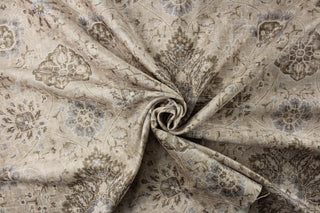 This P/Kaufmann© Sariz fabric in Pearl features a Jacobean floral print, in shades of blue, brown, white, and taupe. Its heavy and durable construction, with a sheen finish, makes it perfect for drapes, bedding, pillows, and light upholstery. With a soil and stain repellant finish and 30,000 double rubs, it is both stylish and practical.