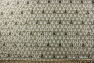 Expertly crafted with a medium weight polyester blend duck base, P/Kaufmann© Grenada in Sandstone adds raised geometrical embroidered accents in a soft neutral sandstone, gray, and white color scheme. With 51,000 double rubs, this multipurpose fabric is ideal for upholstering furniture and creating stunning drapery.