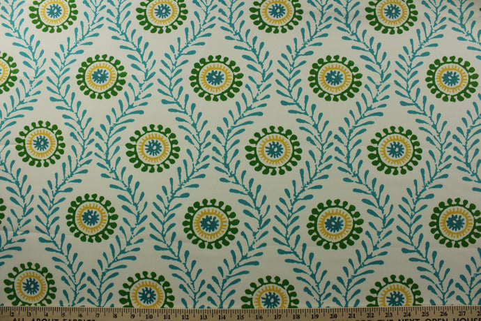 Featuring a bright suzani floral print in shades of turquoise, yellow, green, and white, this fabric is sure to add a lively pop of color to any space.  Made with 51,000 double rubs, it is durable and long-lasting.  The versatile fabric is perfect for window accents (draperies, valances, curtains and swags) cornice boards, accent pillows, bedding, headboards, cushions, ottomans, slipcovers and upholstery. <span data-mce-fragment=