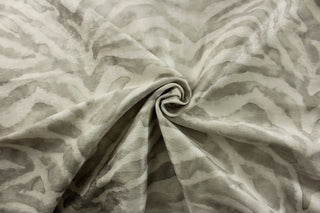 Introducing P Kaufmann© Banjar in Silver, a stunning multipurpose fabric. With a sleek zebra print in silver and pearl white, this fabric is perfect for adding a touch of sophistication to any project.&nbsp;Great for upholstery projects including sofas, chairs, dining chairs, pillows, handbags and craft projects.&nbsp;&nbsp;