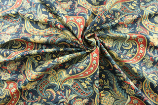 paisley print on a basketweave cotton fabric. The rich jewel tones of gold, red, cream, medium blue, and crimson stand out against the navy background. With a durability of 24,000 double rubs, this fabric is both stylish and functional. Perfect&nbsp;for window accents (draperies, valances, curtains and swags) cornice boards, accent pillows, bedding, headboards, cushions, ottomans, slipcovers and upholstery. <span data-mce-fragment="1">&nbsp;</span>