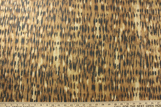  Expertly crafted with printed chenille, P Kaufmann© Tonga in Ginger decorator fabric boasts an elegant animal print in rich ginger, black, and cream tones. With shimmering bronze highlights and a high double rub count of 51,000, this fabric delivers both style and durability. Great for upholstery projects including sofas, chairs, dining chairs, pillows, handbags and craft projects.&nbsp;&nbsp;