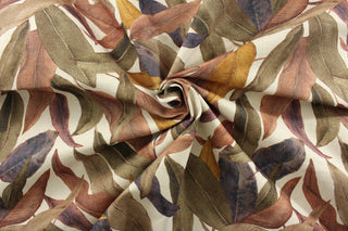 Golding Fabrics© Easy Breezy in Fig is the perfect choice for durable and stylish upholstery or drapery. The tropical palm leaves in shades of oak brown, eggplant purple, gold, and reddish brown add a touch of exotic elegance to any space. With 50,000 double rubs, this fabric is built to withstand daily wear and tear.