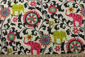 This printed outdoor fabric boasts a stunning display of elephants and medallions in lime, dark hot pink, red, gray, and black on an off-white background. With 15,000 double rubs and a 500 UV rating, this fabric is as durable as it is eye-catching. Great for<span data-mce-fragment="1">&nbsp;cushions, tablecloths, upholstery projects, decorative pillows and craft projects.&nbsp; Recommended to store away when not in use.</span>