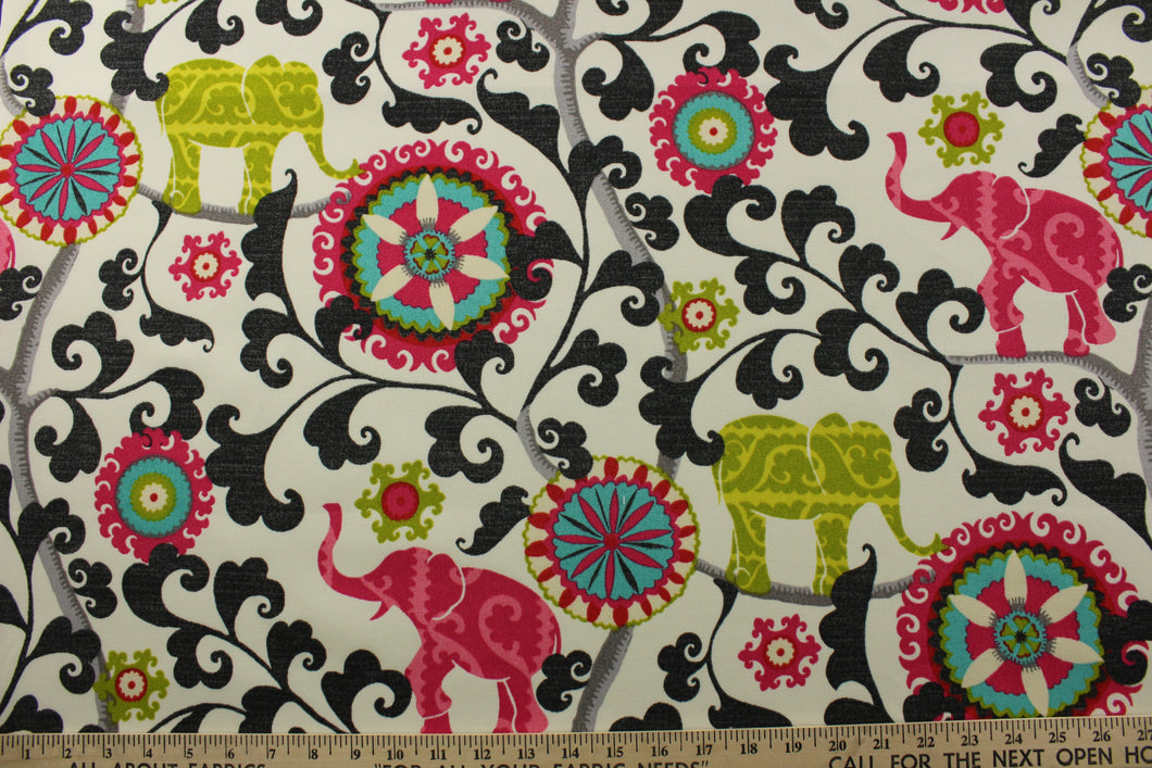 This printed outdoor fabric boasts a stunning display of elephants and medallions in lime, dark hot pink, red, gray, and black on an off-white background. With 15,000 double rubs and a 500 UV rating, this fabric is as durable as it is eye-catching. Great for<span data-mce-fragment=