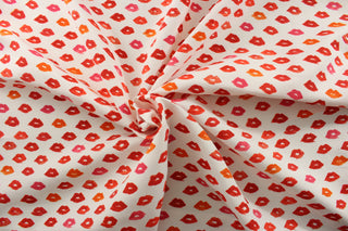Introducing PK Lifestyles© Novogratz Outdoor Lips In Glam, featuring bold red lips against a crisp white background.&nbsp; Elevate your outdoor space with this playful and eye-catching design.&nbsp; With a remarkable 33,000 double rubs, it's built to last.&nbsp; Great for<span data-mce-fragment="1">&nbsp;cushions, tablecloths, upholstery projects, decorative pillows and craft projects.&nbsp; Recommended to store away when not in use.</span>