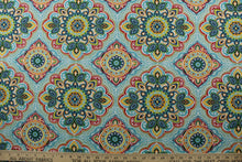 Load image into Gallery viewer, featuring a decorative medallion print in red, blue, green, yellow, orange, and opal with a touch of crisp white. With 15,000 double rubs, this durable and stylish fabric is perfect for adding a touch of elegance to any space. Plus, with 500 UV hours and water and stain resistant properties, it&#39;s great for lounge cushions, pool furniture, tablecloths, decorative pillows and upholstery projects. &lt;span data-mce-fragment=&quot;1&quot;&gt;Recommended to store away when not in use.&lt;/span&gt;
