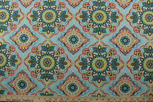 featuring a decorative medallion print in red, blue, green, yellow, orange, and opal with a touch of crisp white. With 15,000 double rubs, this durable and stylish fabric is perfect for adding a touch of elegance to any space. Plus, with 500 UV hours and water and stain resistant properties, it's great for lounge cushions, pool furniture, tablecloths, decorative pillows and upholstery projects. <span data-mce-fragment="1">Recommended to store away when not in use.</span>