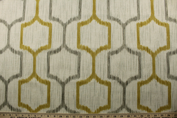 Expertly crafted with durable polyester, the Richloom© Sawson in Greystone brings a touch of elegance to any room. Its ikat geometric print adds a subtle pop of pattern, while the dull gold and gray hues complement a variety of décor styles. Perfect for creating stunning drapery.