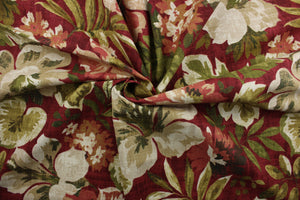 Magnolia is a large floral print featuring a vibrant mix of scarlet red, green, beige, and cream. The versatile fabric is perfect for window accents (draperies, valances, curtains and swags) cornice boards, accent pillows, bedding, headboards, cushions, ottomans, slipcovers and light duty upholstery.  