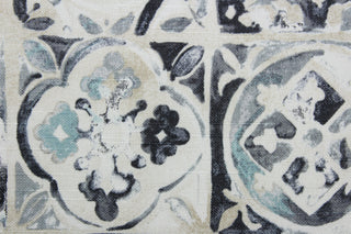  Petra Tile features a stunning floral tile design in a variety of shades, including dark grey, grey, sky blue, beige, and off white. This multi use fabric provides an impressive 39,000 double rubs and is perfect for window accents (draperies, valances, curtains and swags) cornice boards, accent pillows, bedding, headboards, cushions, ottomans, slipcovers and light duty upholstery.  