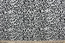 Load image into Gallery viewer, Our Leopard in Gray fabric offers a unique combination of style and comfort. The bold leopard print is textured and soft, making it ideal for drapery and apparel. Add a touch of style to your home décor or wardrobe with this stylish fabric.
