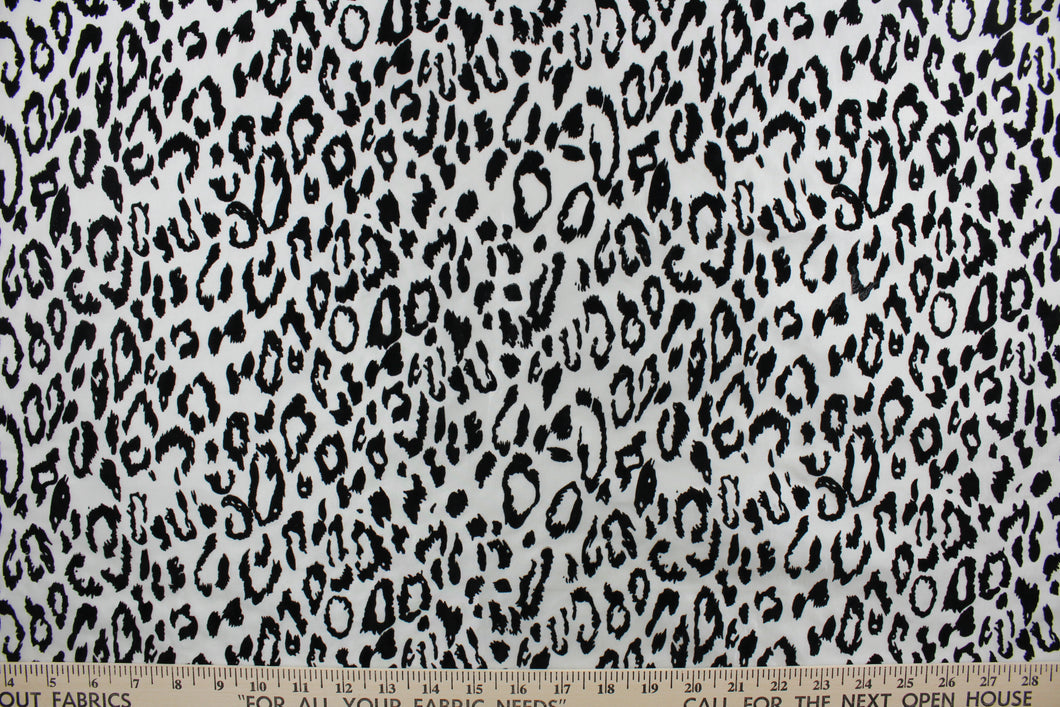 Our Leopard in Gray fabric offers a unique combination of style and comfort. The bold leopard print is textured and soft, making it ideal for drapery and apparel. Add a touch of style to your home décor or wardrobe with this stylish fabric.