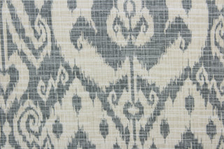Ashmore offers an outdoor print in an ikat design, blending beautiful shades of pebble gray and light beige.  This versatile, long-lasting fabric can withstand up to 500 hours of sunlight, water and stain resistant and has 10,000 double rubs.  It is perfect for lounge cushions, pool furniture, tablecloths, decorative pillows and upholstery projects.  This fabric has a slightly stiff feel but is easy to work with.  