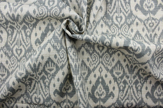 Ashmore offers an outdoor print in an ikat design, blending beautiful shades of pebble gray and light beige.  This versatile, long-lasting fabric can withstand up to 500 hours of sunlight, water and stain resistant and has 10,000 double rubs.  It is perfect for lounge cushions, pool furniture, tablecloths, decorative pillows and upholstery projects.  This fabric has a slightly stiff feel but is easy to work with.  