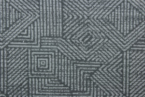 This Solarium outdoor decorative print features a geometric design in stone gray.  This versatile, long-lasting fabric can withstand up to 500 hours of sunlight, water and stain resistant and has 10,000 double rubs.  It is perfect for lounge cushions, pool furniture, tablecloths, decorative pillows and upholstery projects.  This fabric has a slightly stiff feel but is easy to work with.  