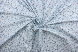  Cicely features an intricate floral pattern in shades of light pink, slate blue, white, and black set against a light blue background.  The high-quality cotton material ensures lasting durability and softness.  It would be great for apparel, quilting, crafting and sewing projects.  