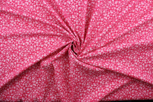 Load image into Gallery viewer, Wildflower features a timeless print of small light pink wildflowers on a simple dark pink background.  The high-quality cotton material ensures lasting durability and softness, making it perfect for your next quilting or stitching project.  The versatile lightweight fabric is soft and easy to sew.  It would be great for apparel, quilting, crafting and sewing projects.  
